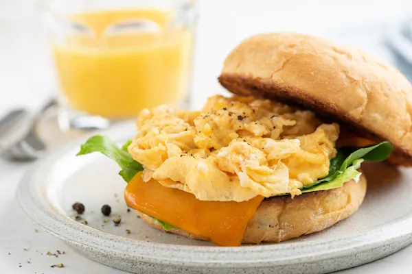 Enjoy a classic fluffy scrambled eggs and melted American yellow cheddar cheese, served on a buttery brioche bun.