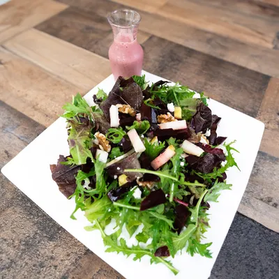 Spring mix, beets, pears, walnuts, goat cheese, pomegranate-champagne vinaigrette dressing on the side.