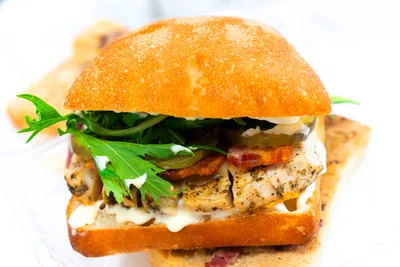 Ciabatta bread, peppercorn aioli, chicken breast, bacon, Havarti cheese, tomatoes, pickles, spring mix