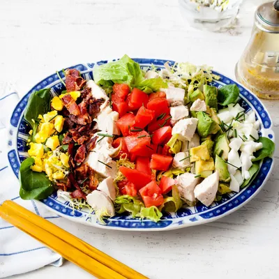 Romaine lettuce, heirloom tomatoes, red onions, thick-cut bacon, avocado, sliced eggs, blue cheese, balsamic vinaigrette