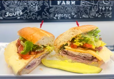 Oven-roasted, turkey, roast beef, thick cut bacon, Havarti cheese, Vermont cheddar, Romaine lettuce, Roma tomatoes, banana peppers, pickles, Dijon, chipotle mayo, on a Dutch crunch roll