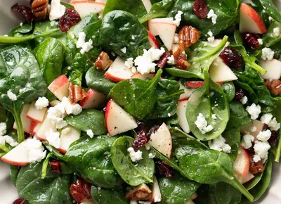 Baby spinach, spring mix, red onions, fuji sliced apples, almonds, goat cheese, champagne vinaigrette dressing on the side.
