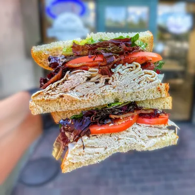 Sourdough bread, peppercorn aioli, turkey, thick-cut bacon, tomatoes, avocado, spring mix