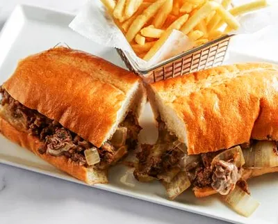 Hoagie roll, Ribeye steak, grilled onions,  American white cheddar 